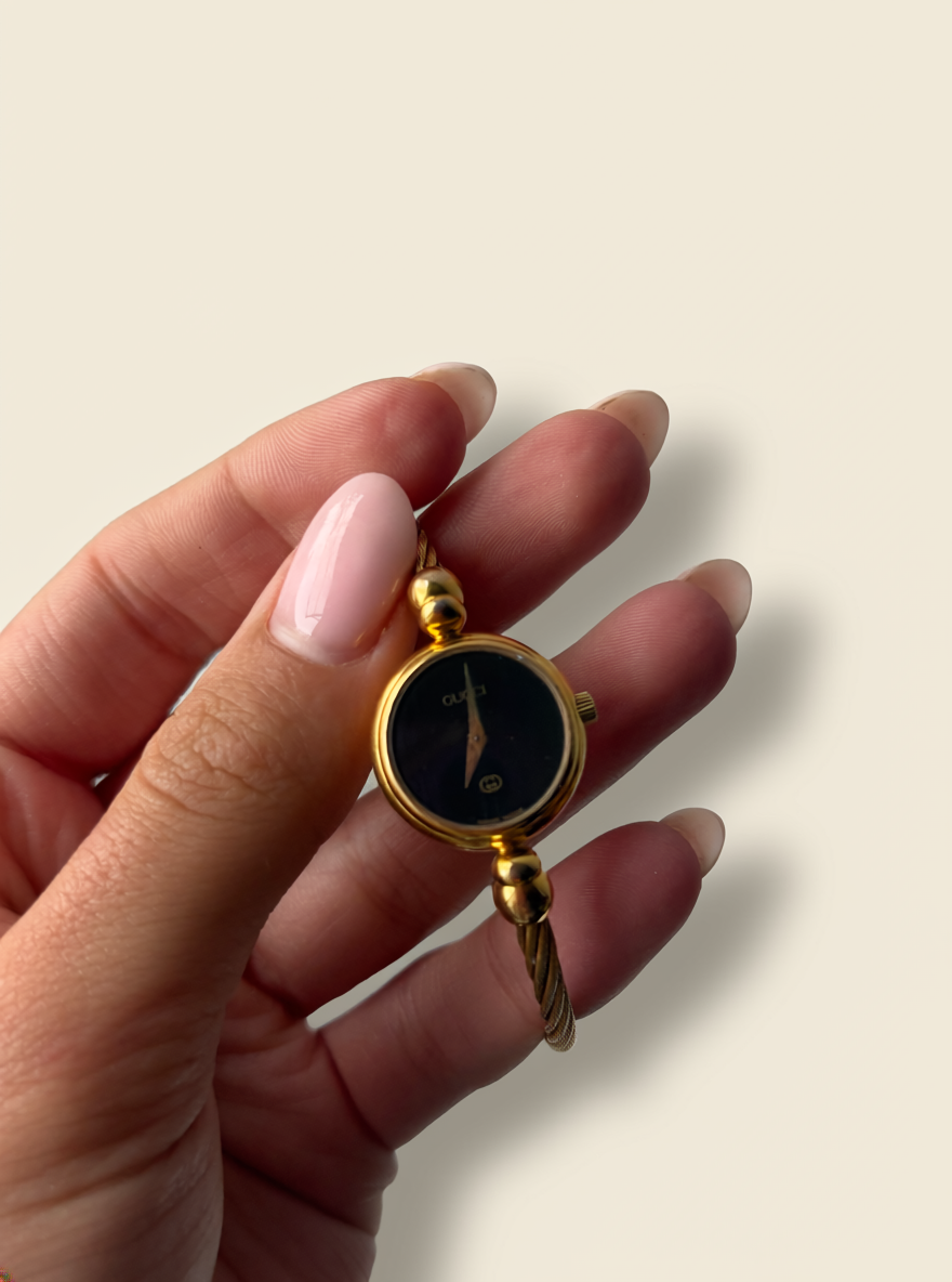 Gucci 2700L Gold Bangle Watch with Black Mother of Pearl Face